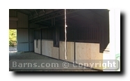 inside horse barn with stalls